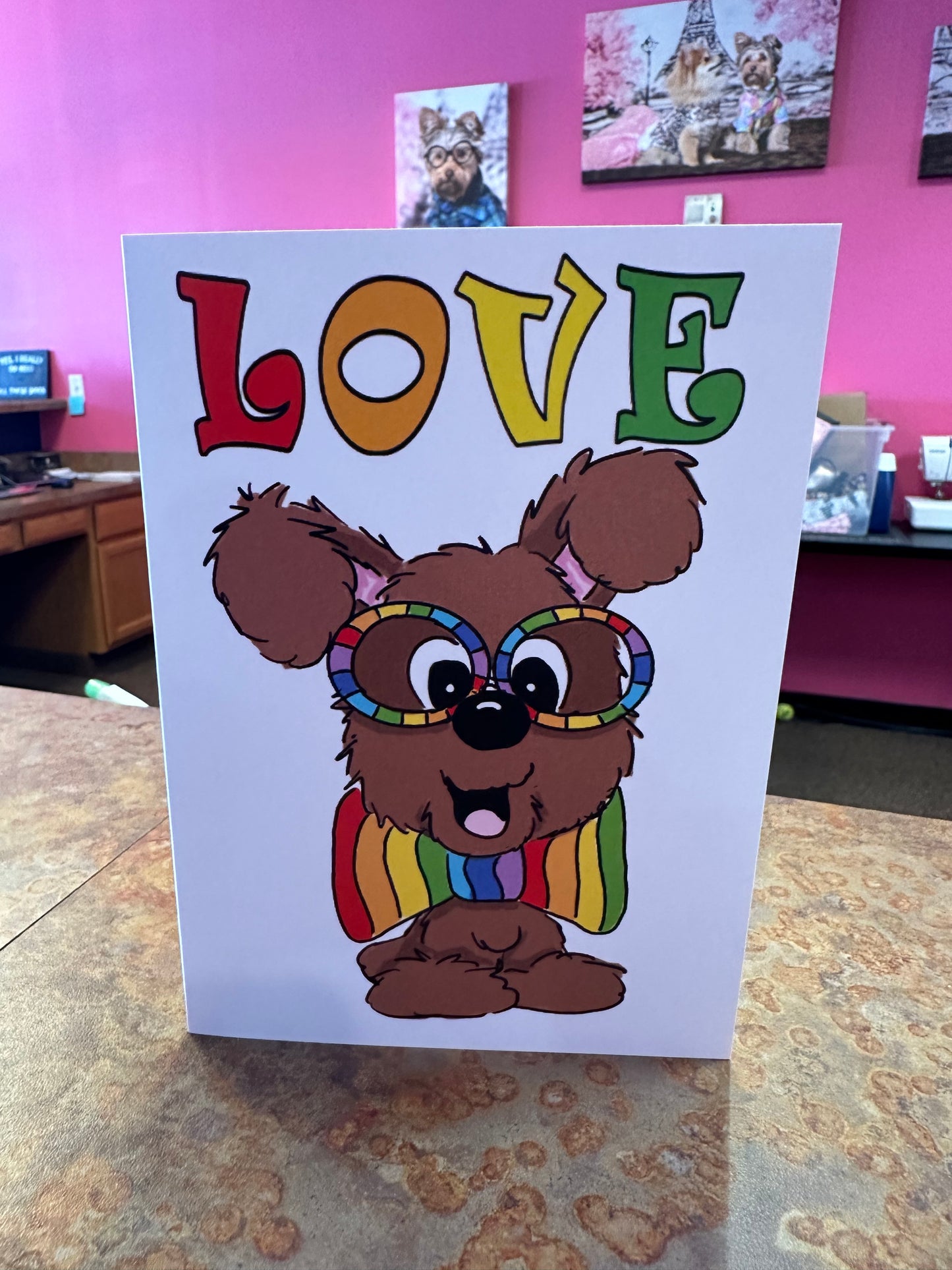 Brown fluffy dog rainbow glasses and bow tie. Love collection