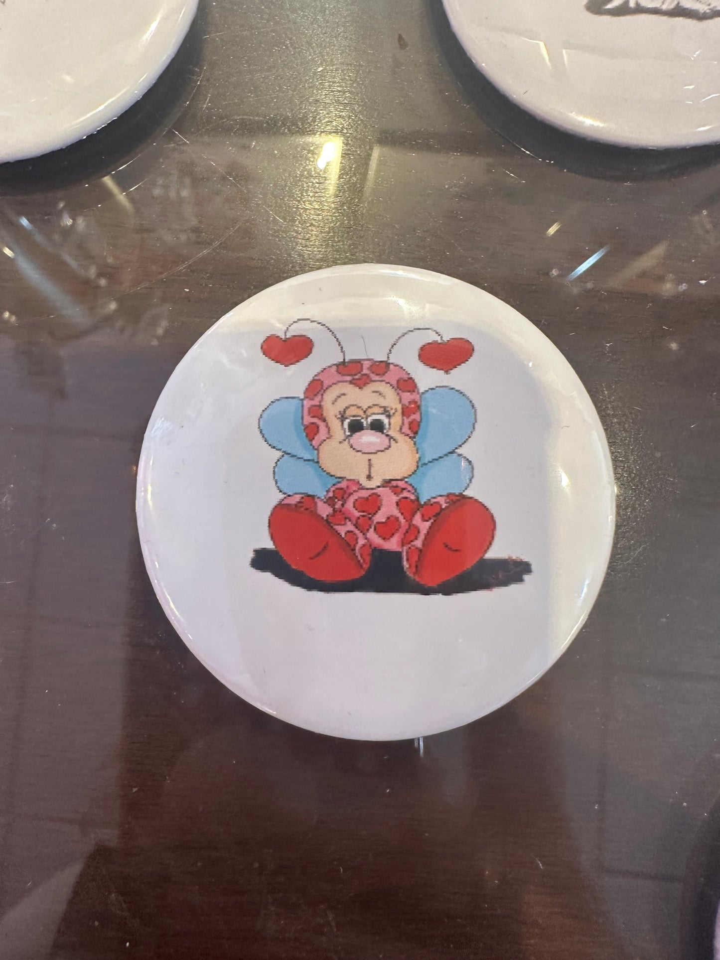 Sitting love bug button